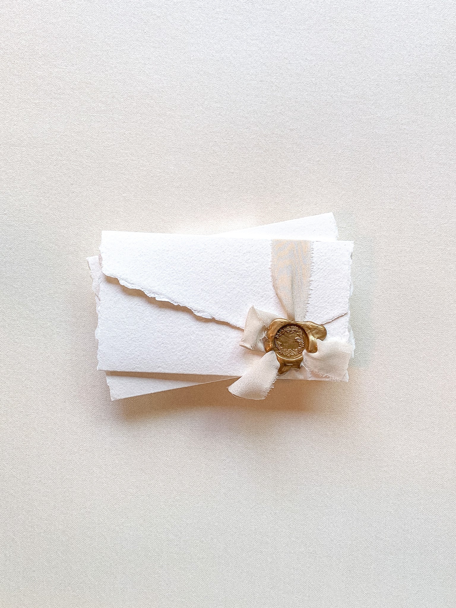 Handmade paper with silk ribbon and wax seal stamp